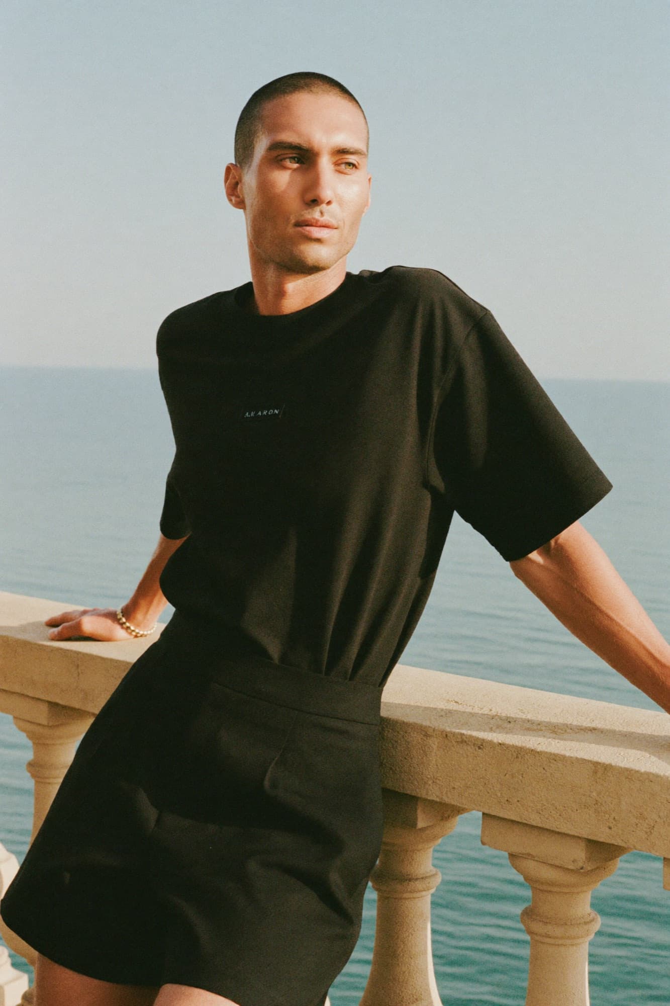 The heavyweight tee at a sun-drenched Mediterranean balustrade, golden hour
