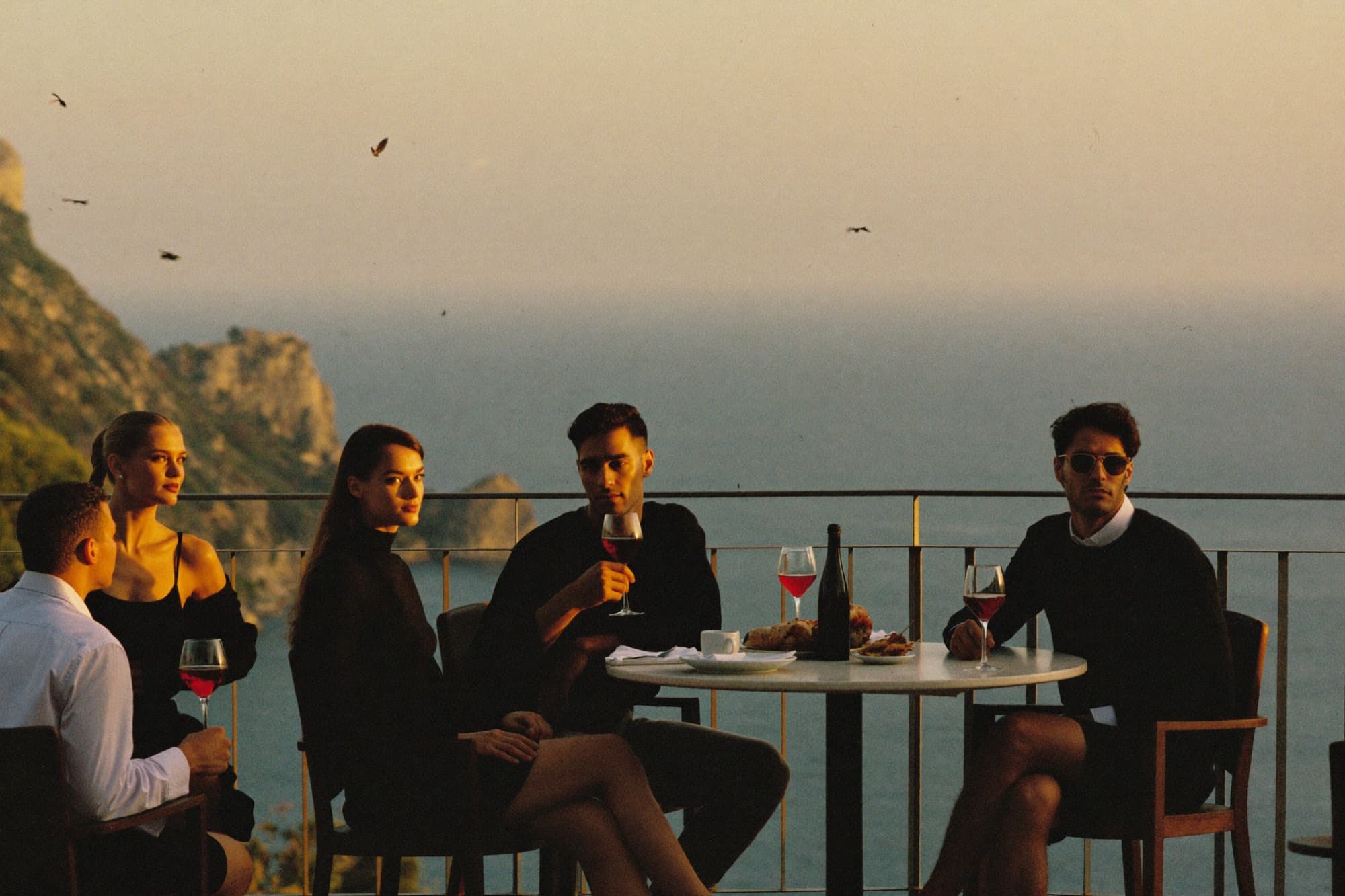 Aperitivo hour in minimal essentials on a Capri terrace overlooking the sea